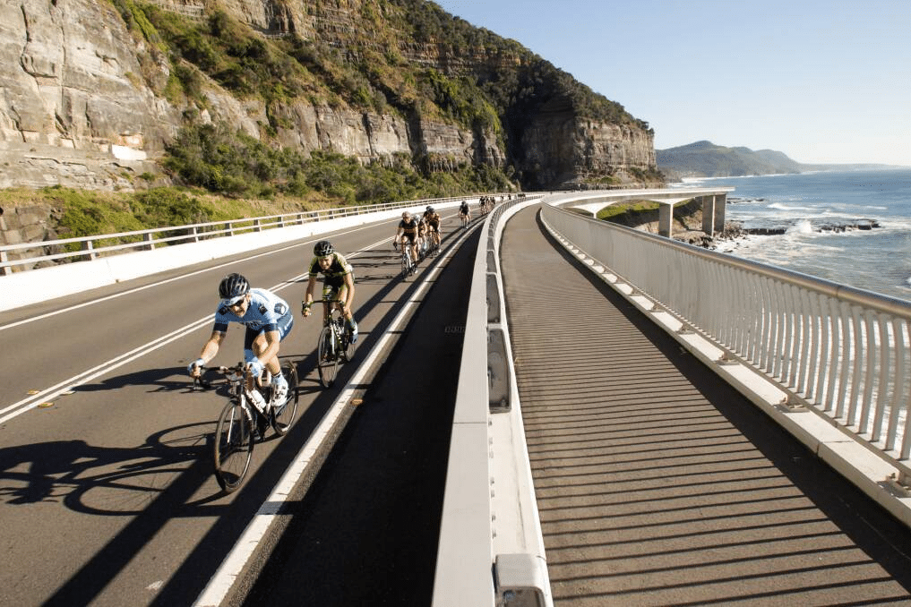 Cyclists on coastal road during sporting event in NSW
