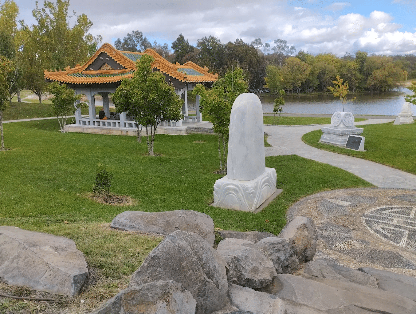 A park with a statue and pagoda in Canberra