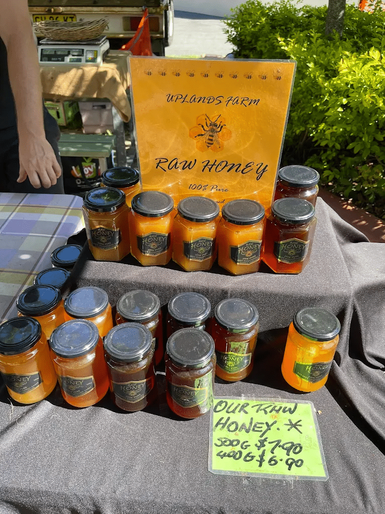A variety of honey jars on a table during a Gold Coast food tour