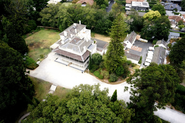 Aerial view of a house in Yarra Melbourne suburbs surrounded by trees
