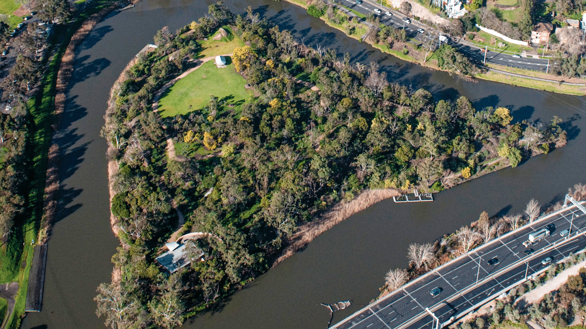 An aerial view of the Yarra River winding through Melbourne suburbs