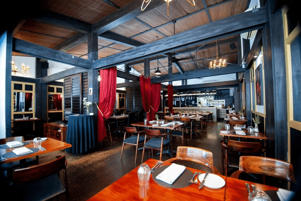 Cozy restaurant interior with wooden tables and chairs in Canberra