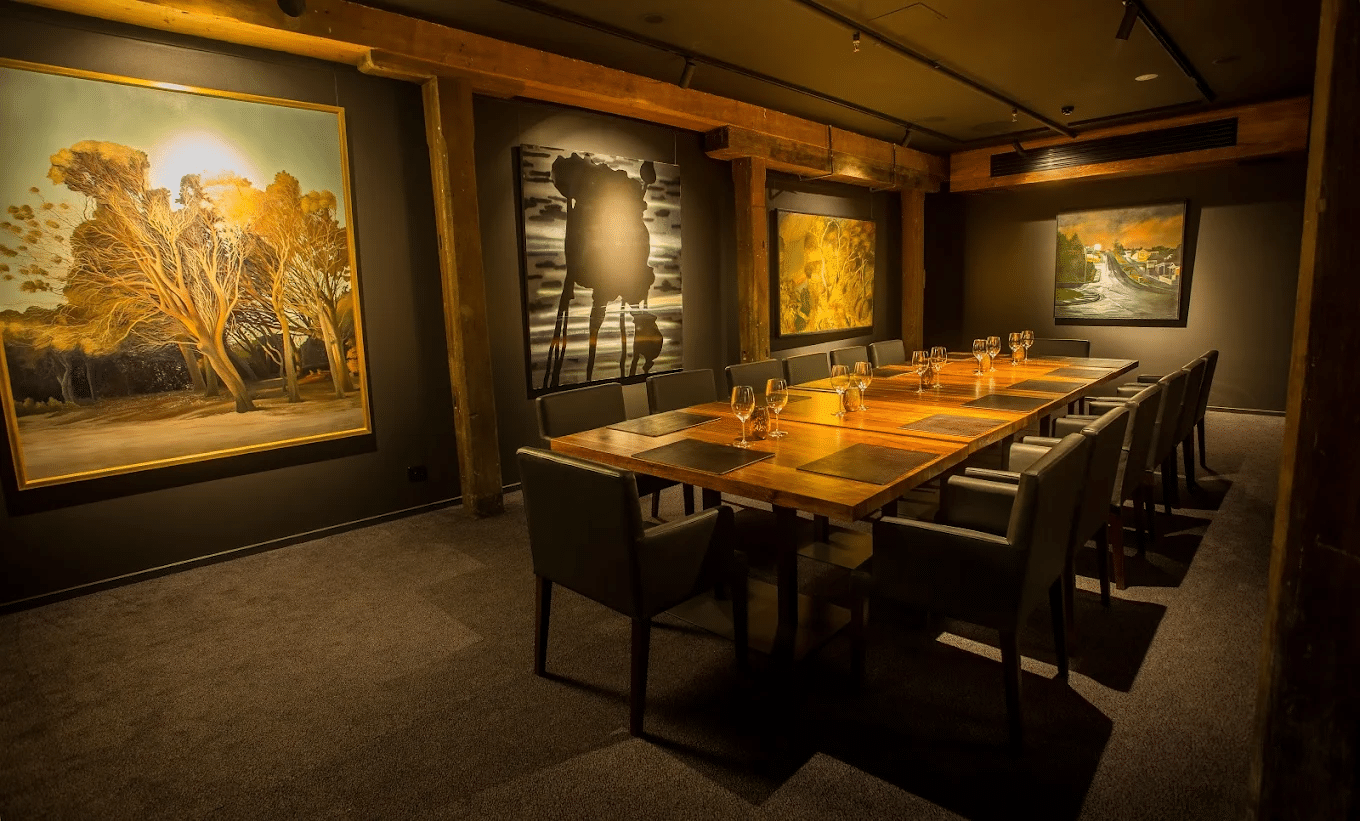 Elegant dining room with long table and wall art