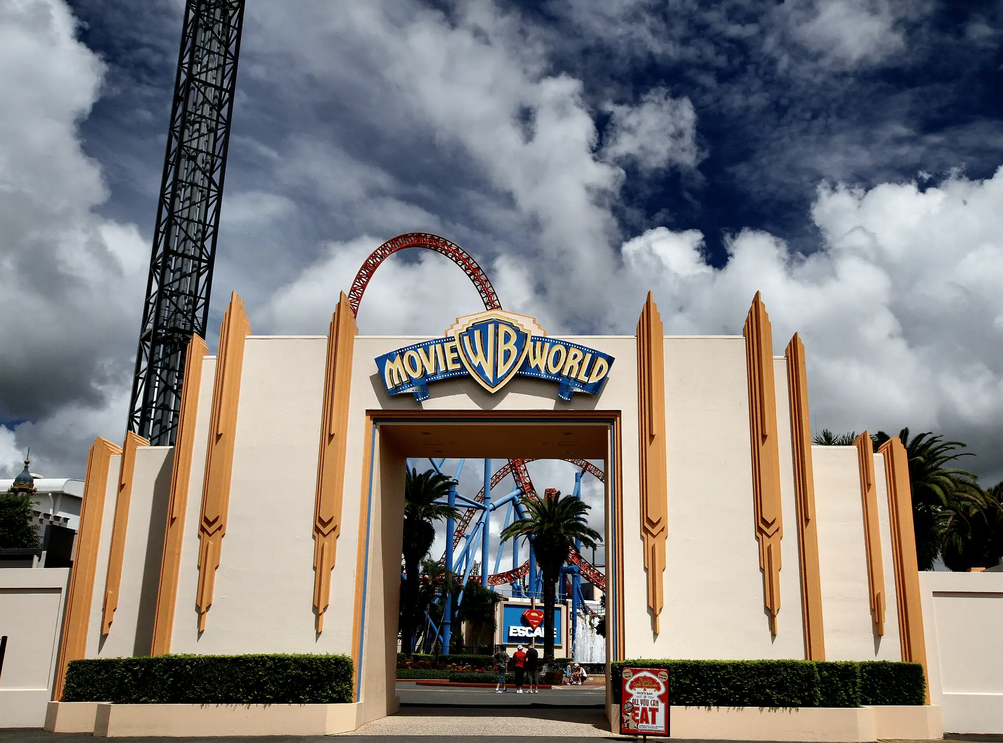entrance to movie world theme park with roller coaster