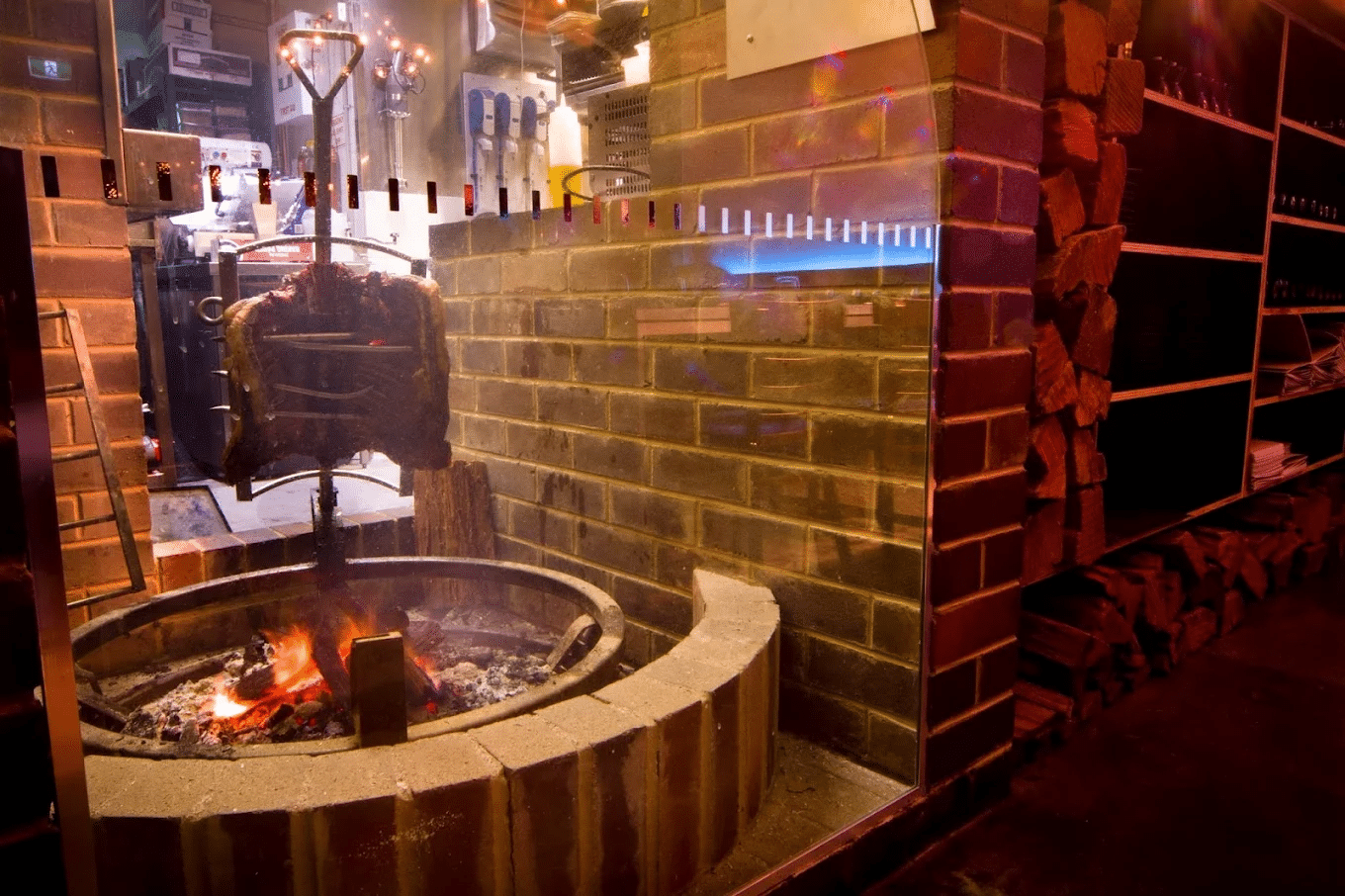Fire pit surrounded by a brick wall at a Canberra dining spot