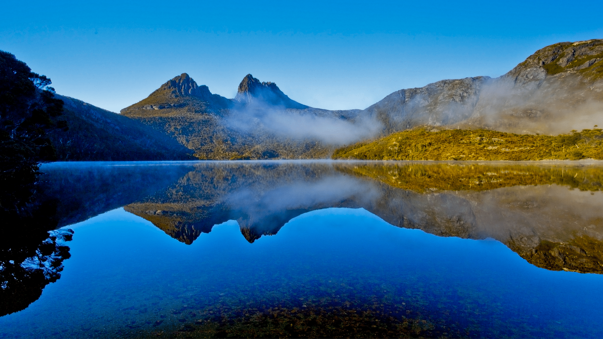 Mountain range reflected in calm water at Hobart nature site