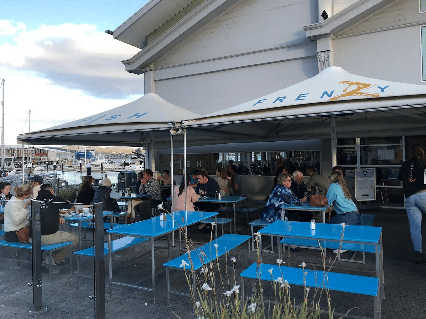 People dining under a tent during a Hobart food tour