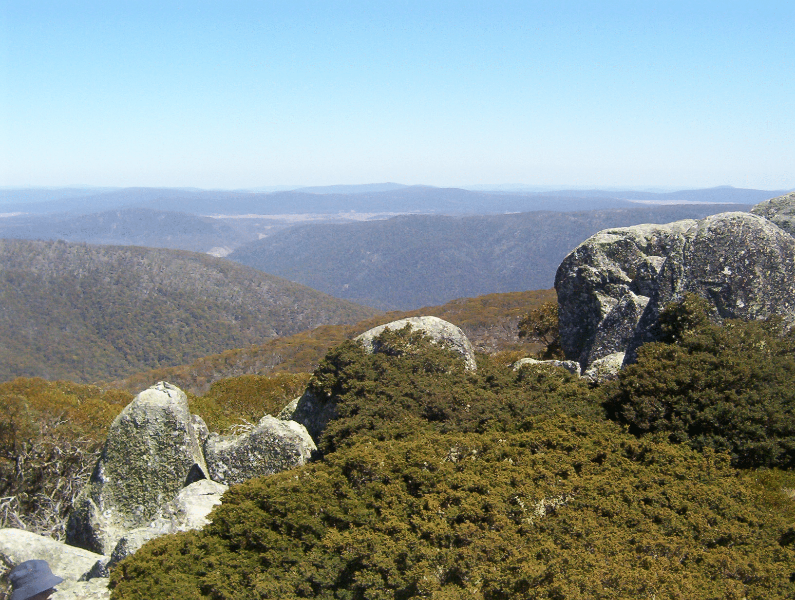 Person atop mountain with valley view in Canberra