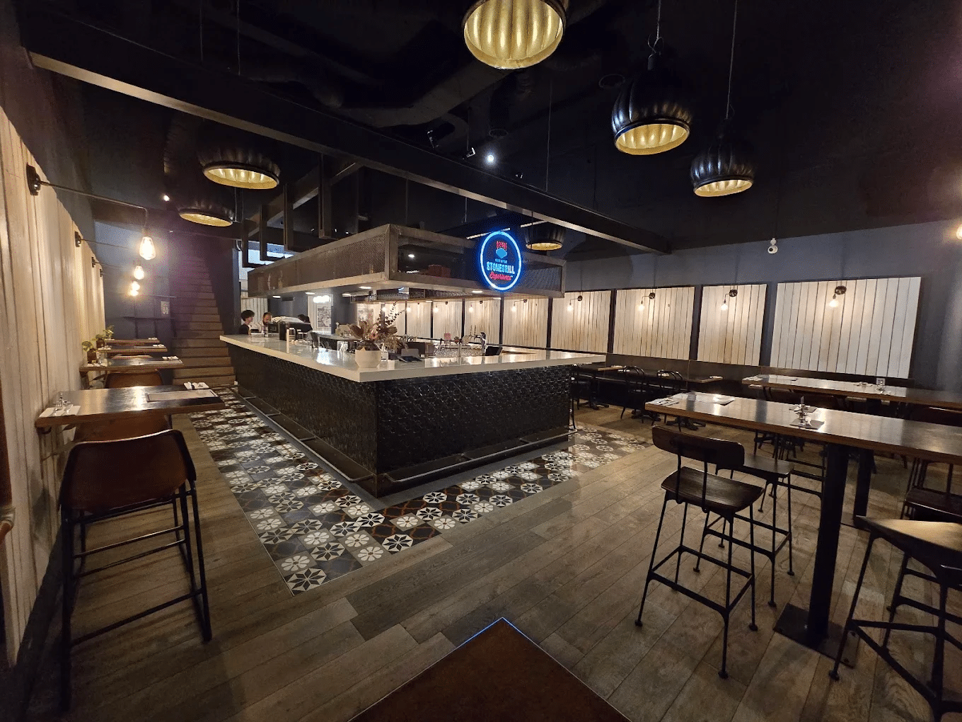 Restaurant interior with tables, chairs, and a bar in Canberra