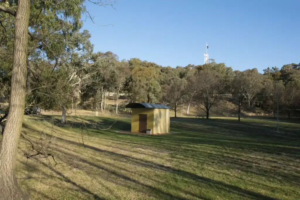 Small yellow building in a Canberra field