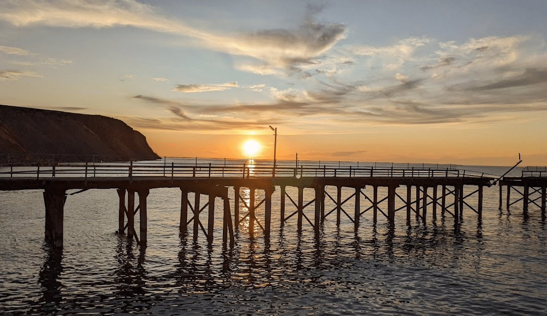 Sunset over a pier in Adelaide, South Australia