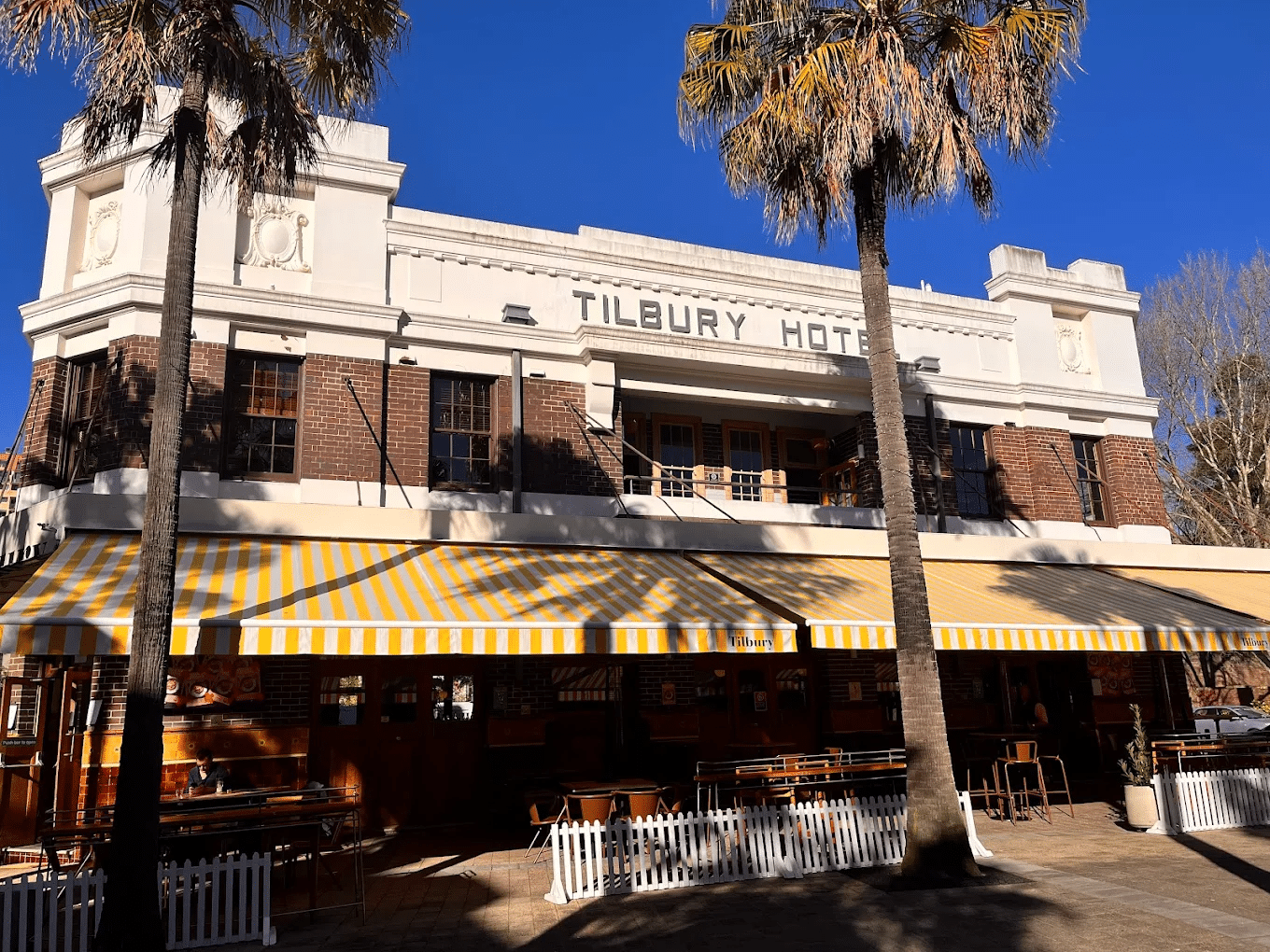Tall building with yellow and white awning in Potts Point Sydney