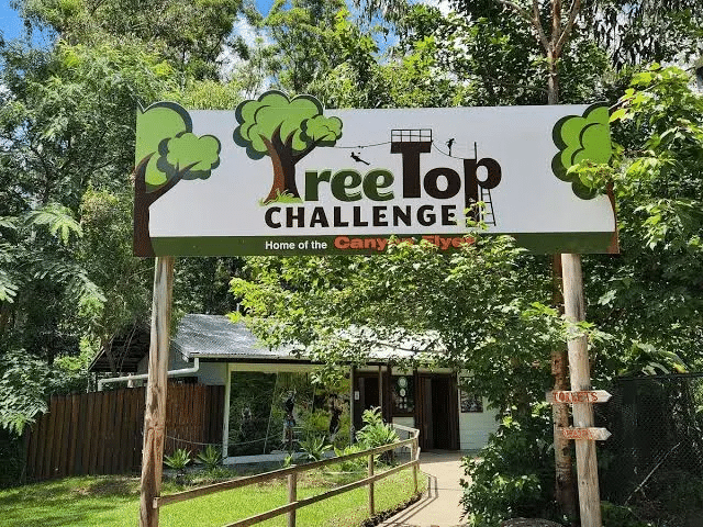 Tree top challenge sign near house in Gold Coast