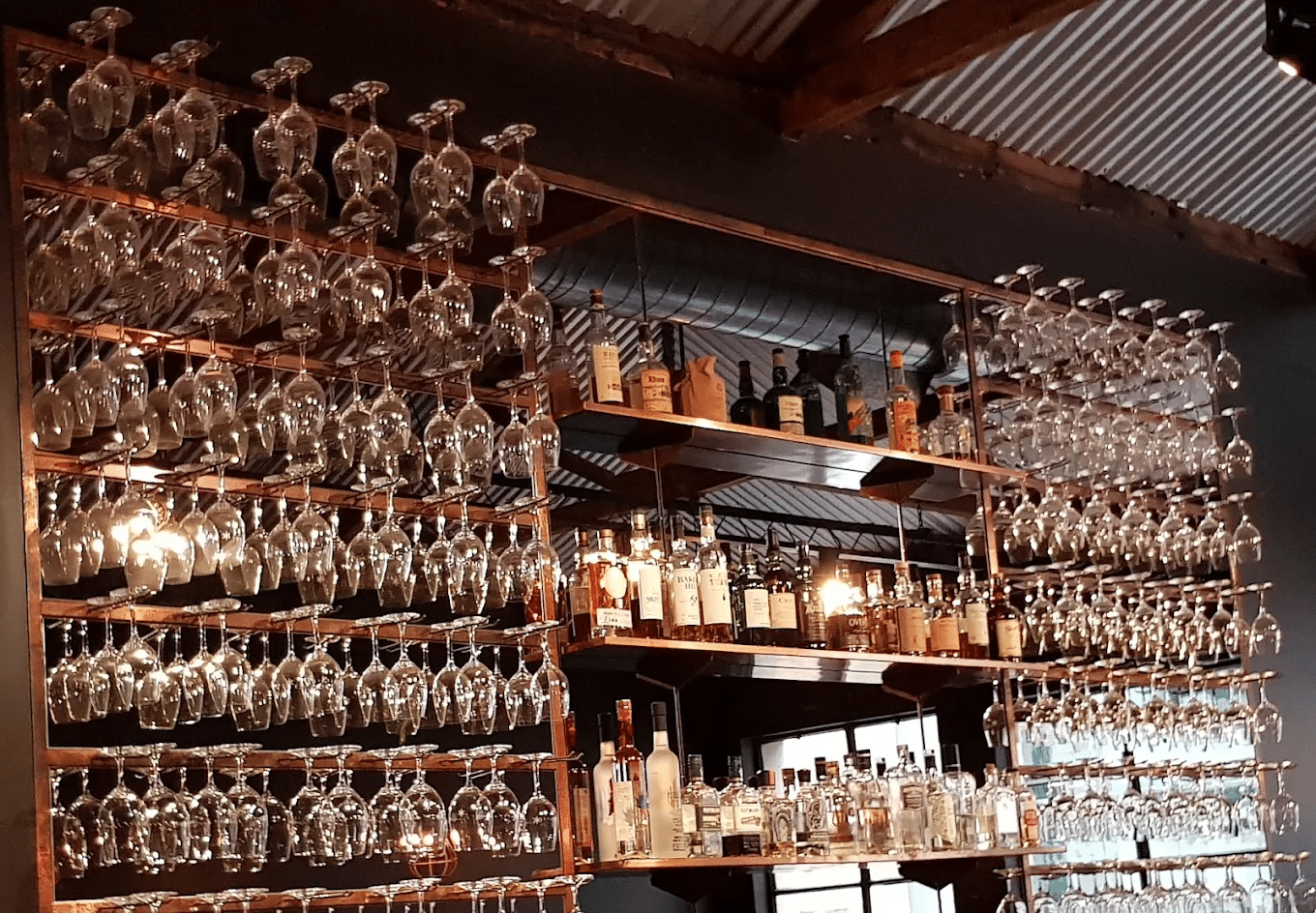 Wine glasses neatly arranged on a shelf