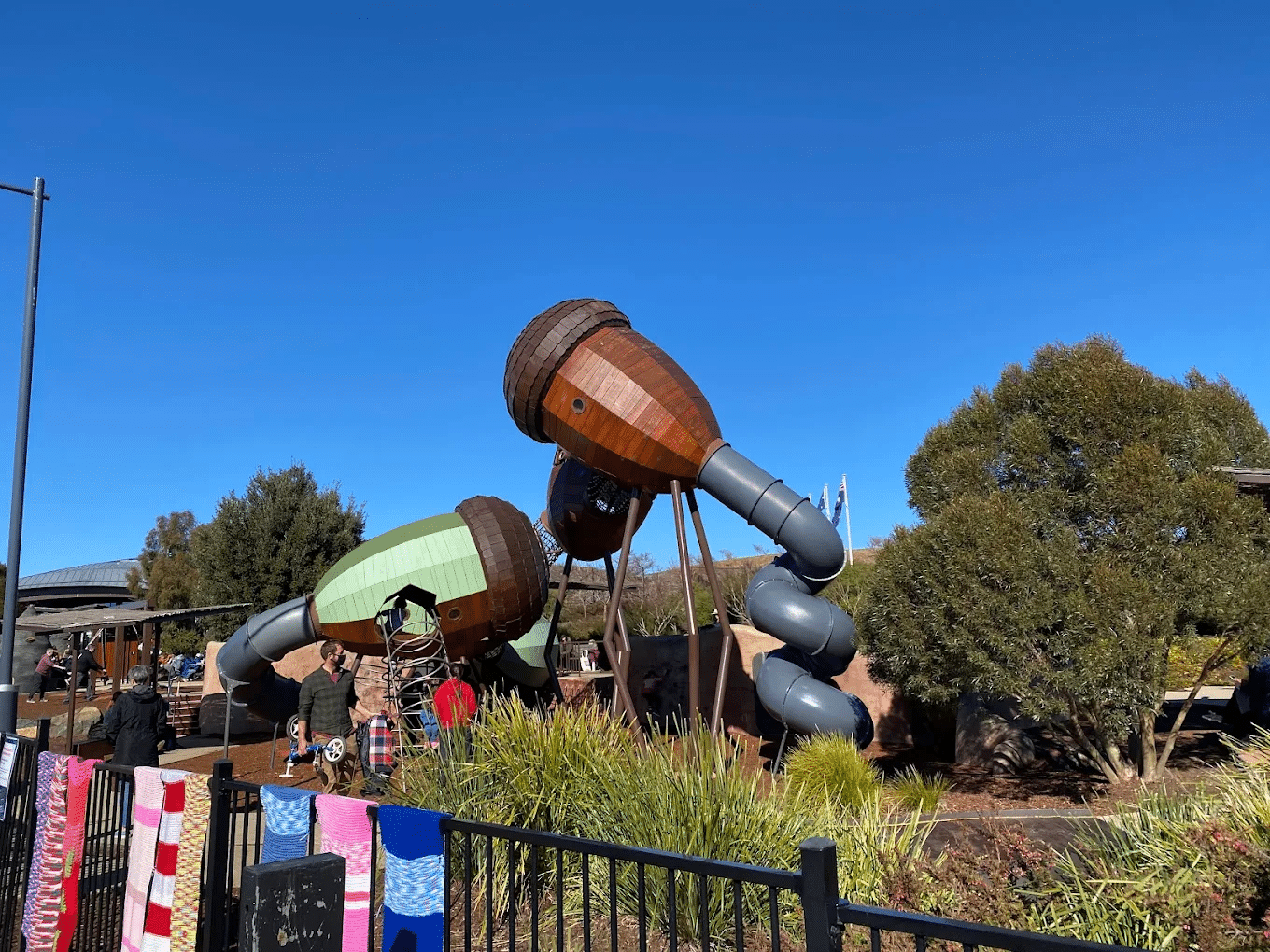 Wooden barrel sculpture with slide in canberra