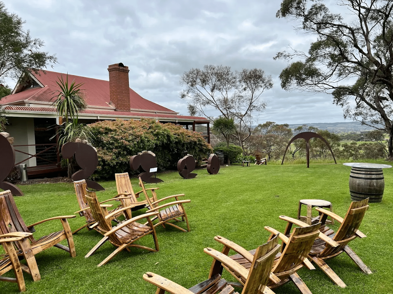 Wooden chairs on green field during Adelaide food tours
