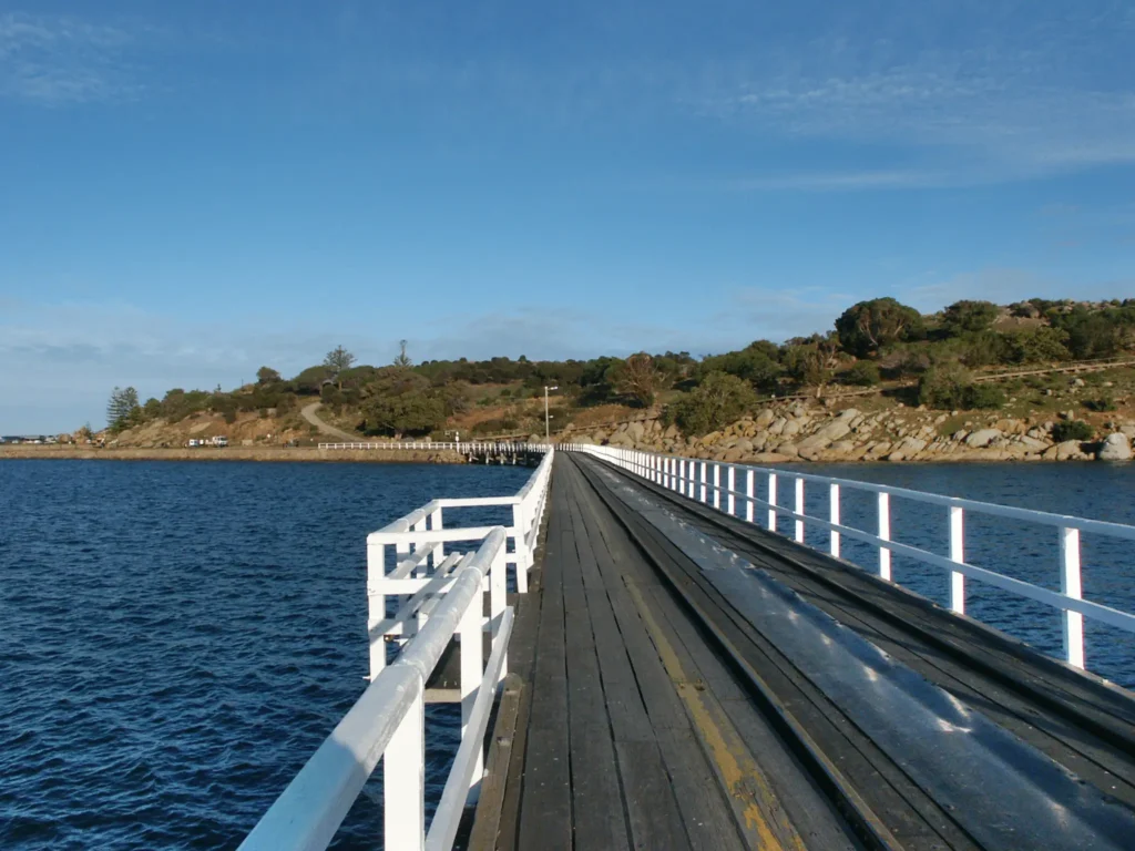 Wooden pier extending into water at a senior-friendly destination in Adelaide