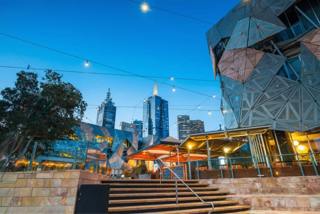A brightly lit building in Melbourne at night