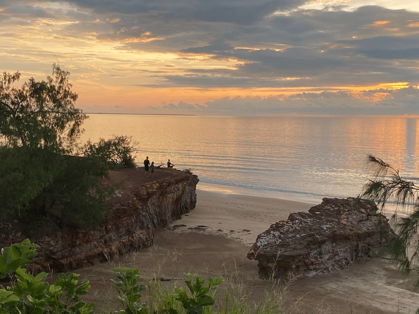 A couple standing on a sandy beach during Darwin nature day trip
