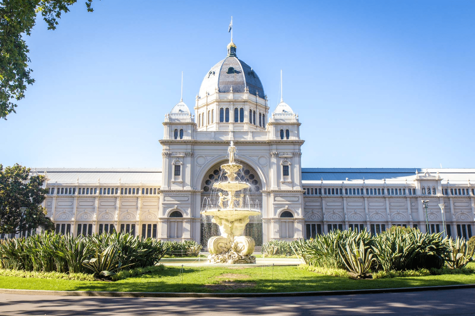 A historical building in Melbourne with a fountain