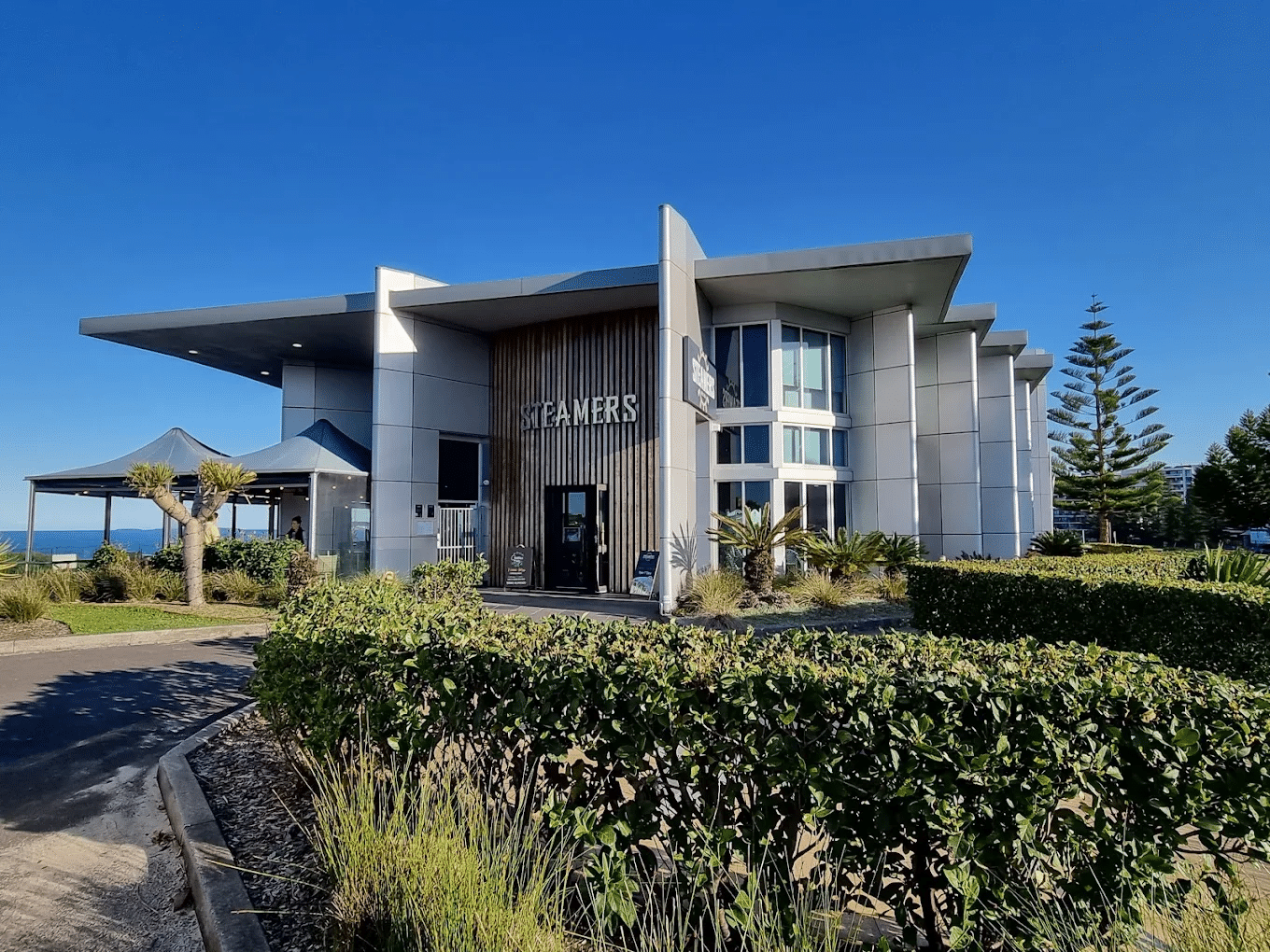 A large building with greenery in front, Wollongong food tour