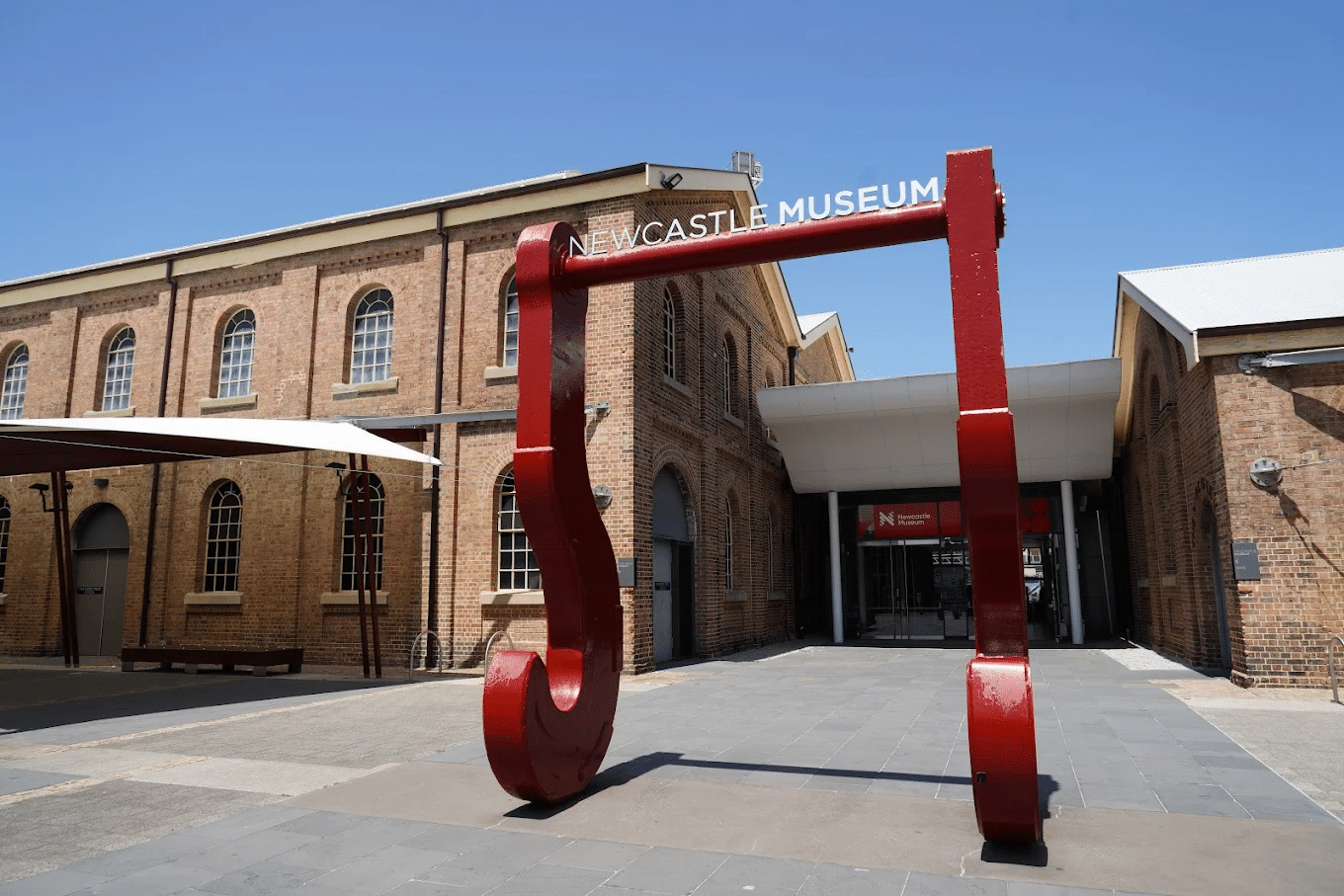A large red sculpture outside a Newcastle building
