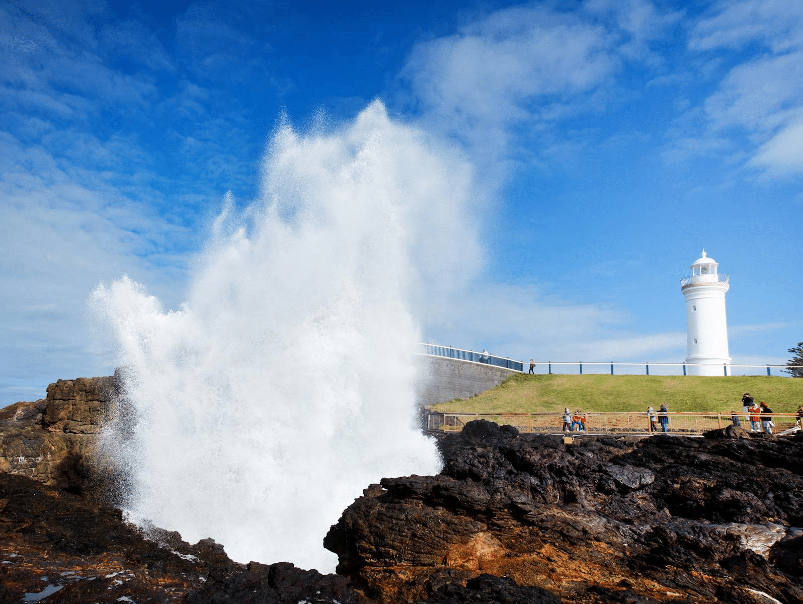 A large wave hitting rocks near Wollongong lighthouse