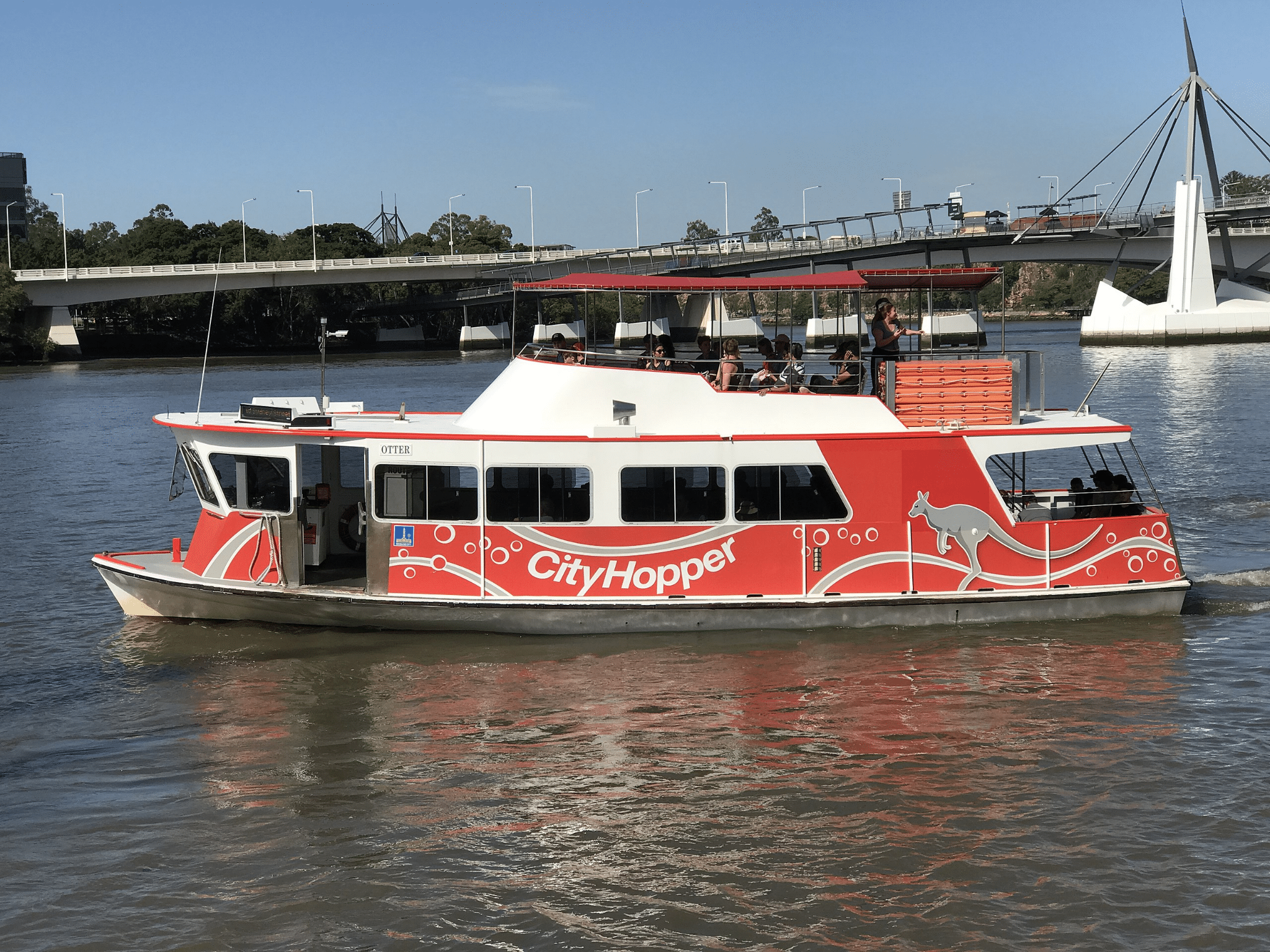 A red and white boat on Brisbane river in South Bank Parklands