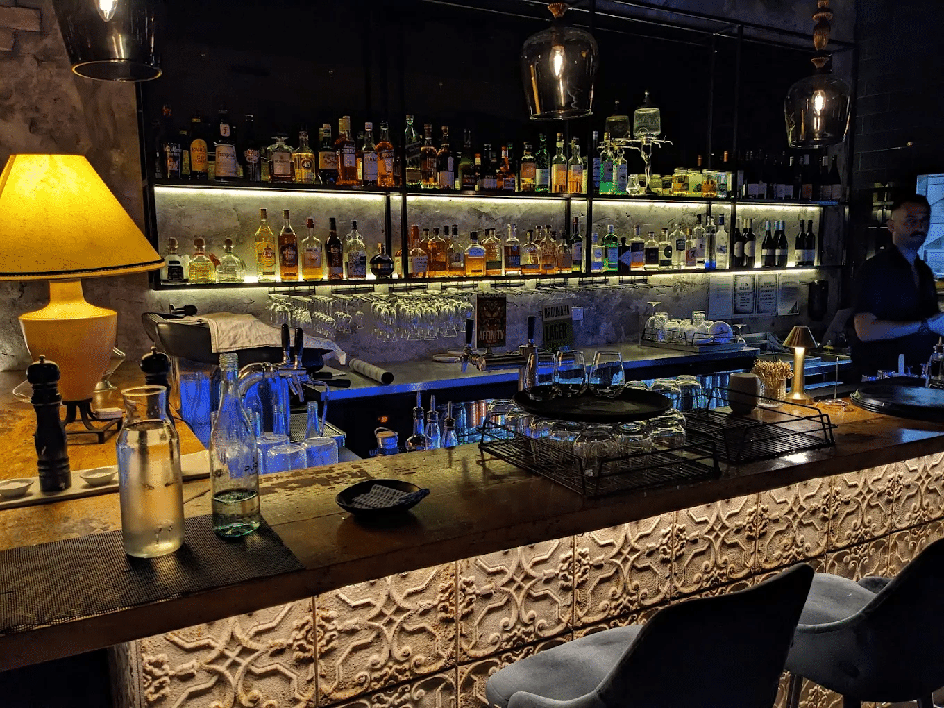 A stocked bar with assorted alcohol bottles in Sunshine Coast