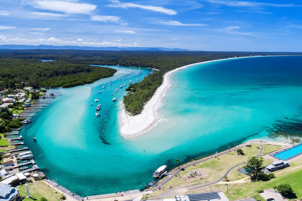Aerial view of a beach with boats in Sydney during spring