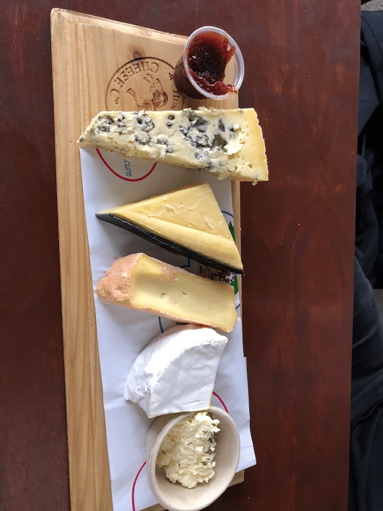 Assorted cheese selection on wooden board in Hunter Valley