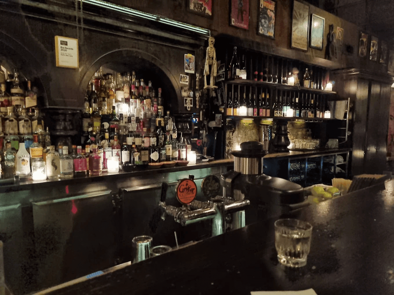 Bar with bottles on wall in Sydney nightlife spot
