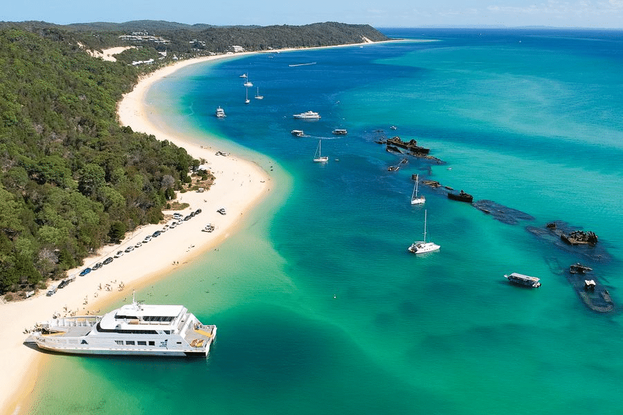 Beach with boats and sandy shore in Brisbane