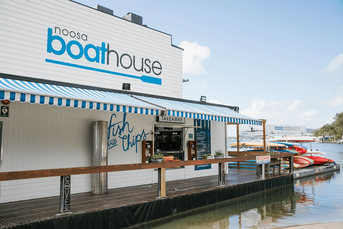 Boathouse on water beside dock during Sunshine Coast food tour