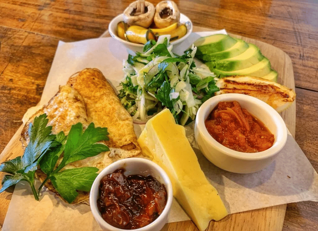 Bowls of food on a wooden table during Sydney food tour