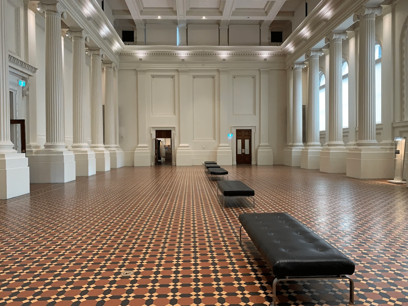 Checkered floor room with bench