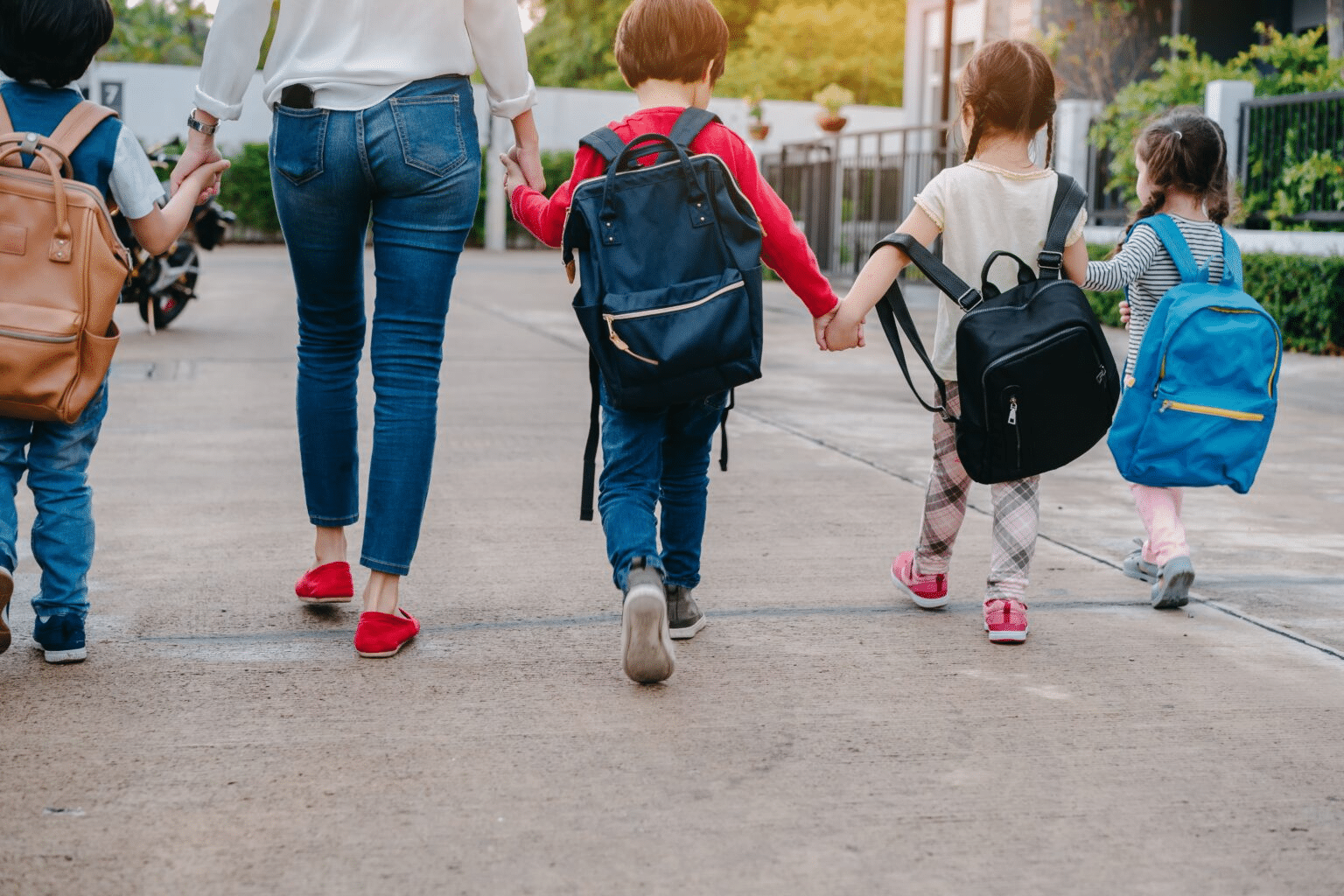 Children walking on sidewalk during new year celebration