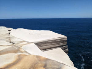 Cliffside view of ocean in Sydney for budget travelers