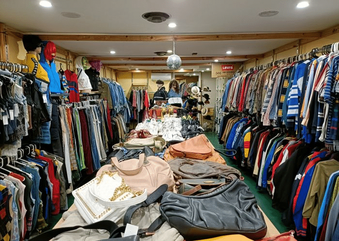 Cluttered room with clothes and handbags in Sydney