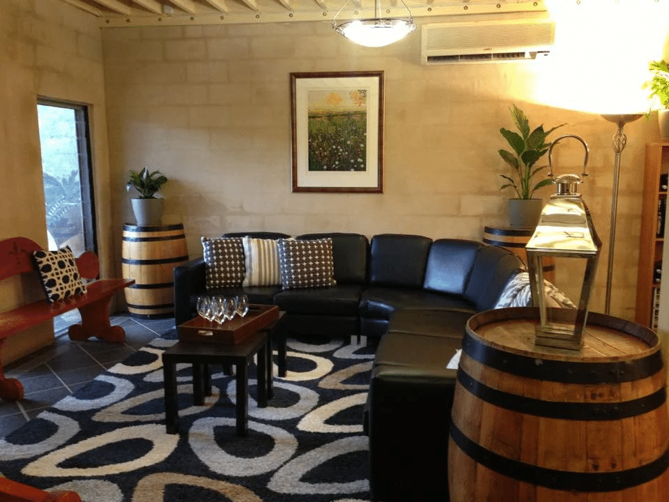 Cozy living room with sofa and wine barrel decor