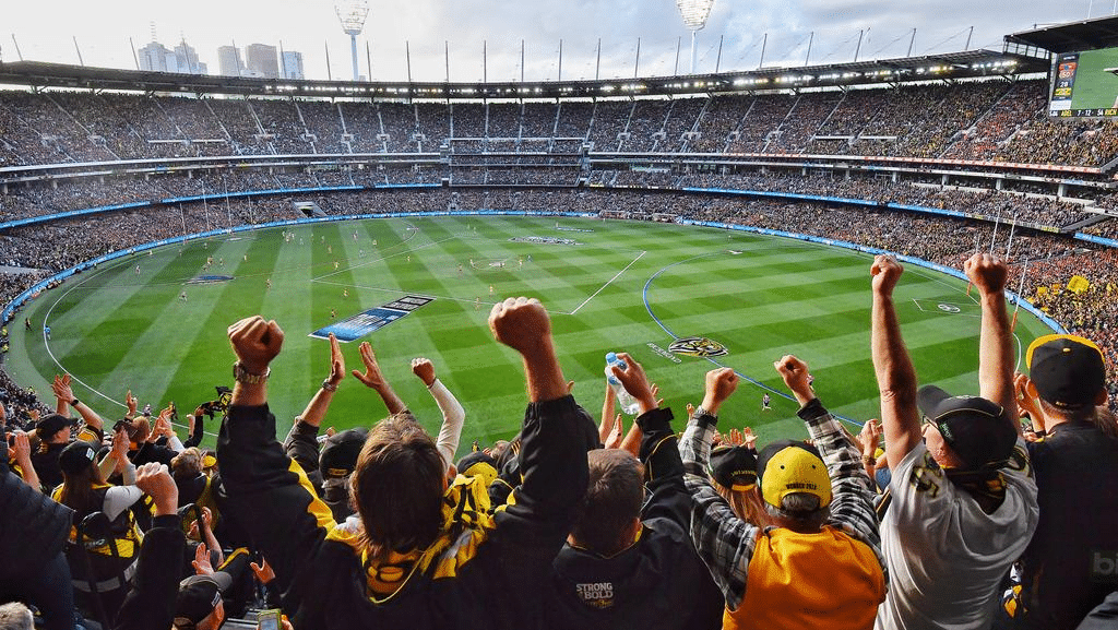 Crowd watching soccer game in Melbourne stadium