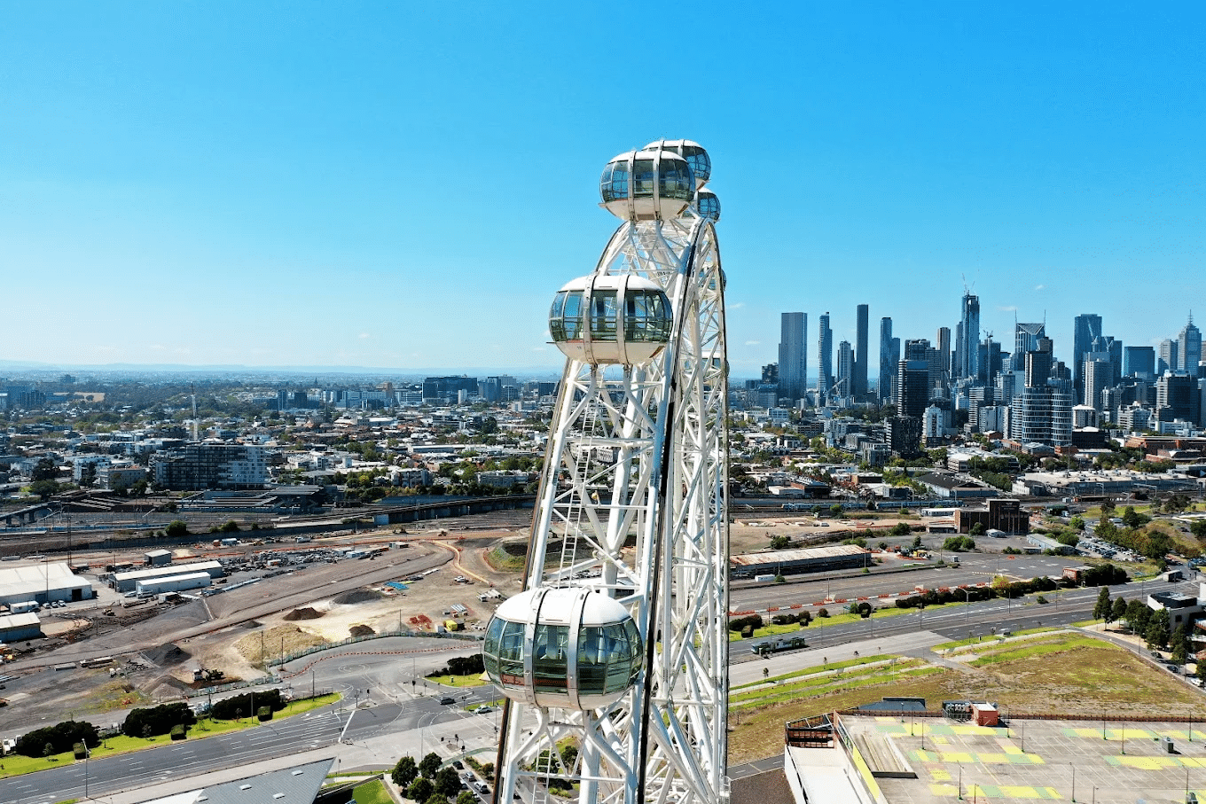 Ferris wheel with Melbourne skyline in background