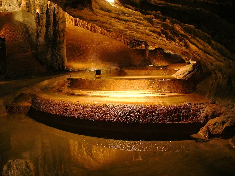 Illuminated water-filled cave in Launceston