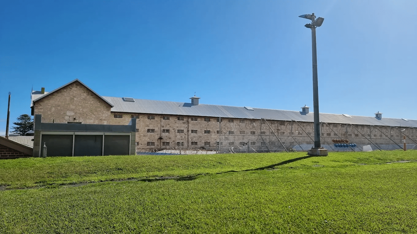 Large brick building on lush green field for school excursions in Perth