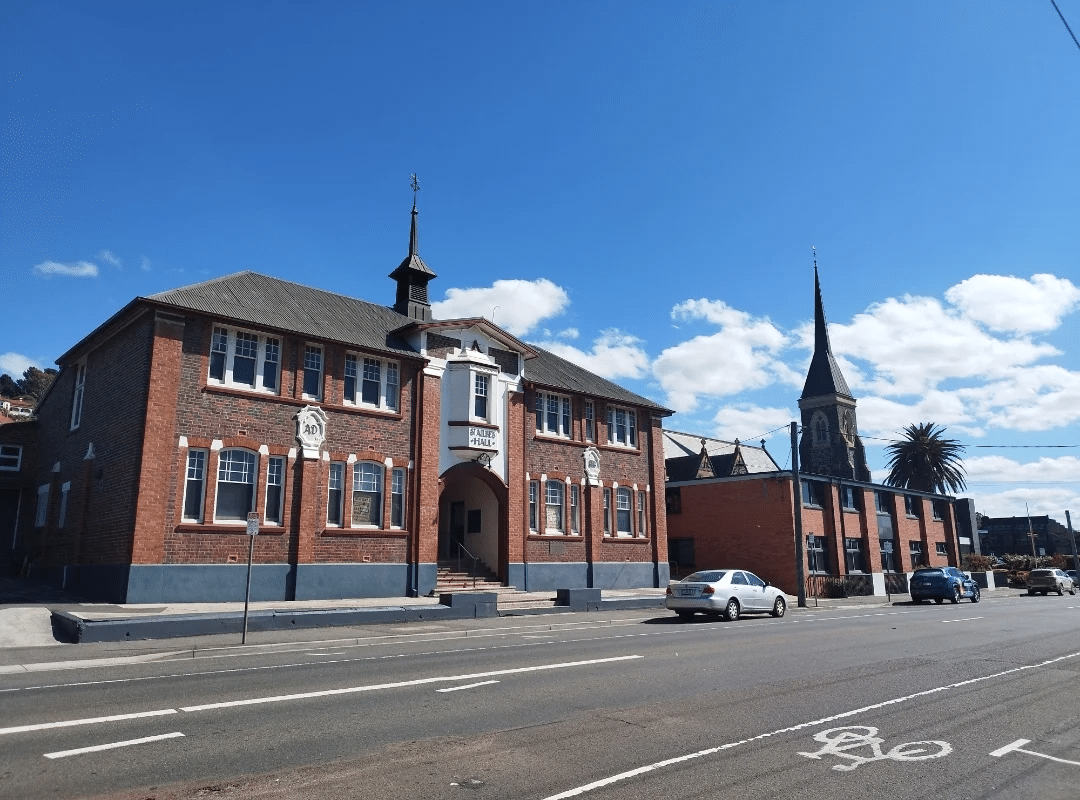 Large brick church with a steeple in Launceston