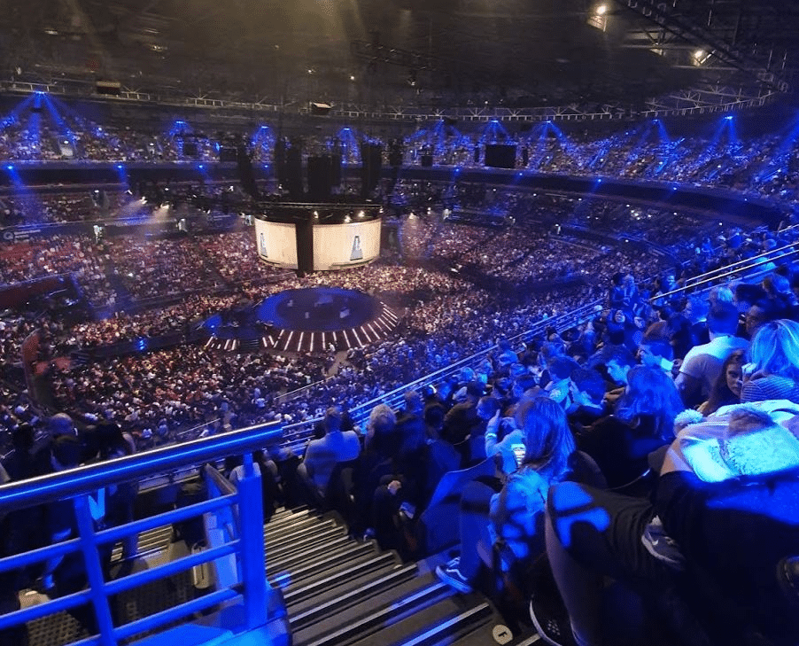 Large crowd of people sitting in a Sydney stadium during church event