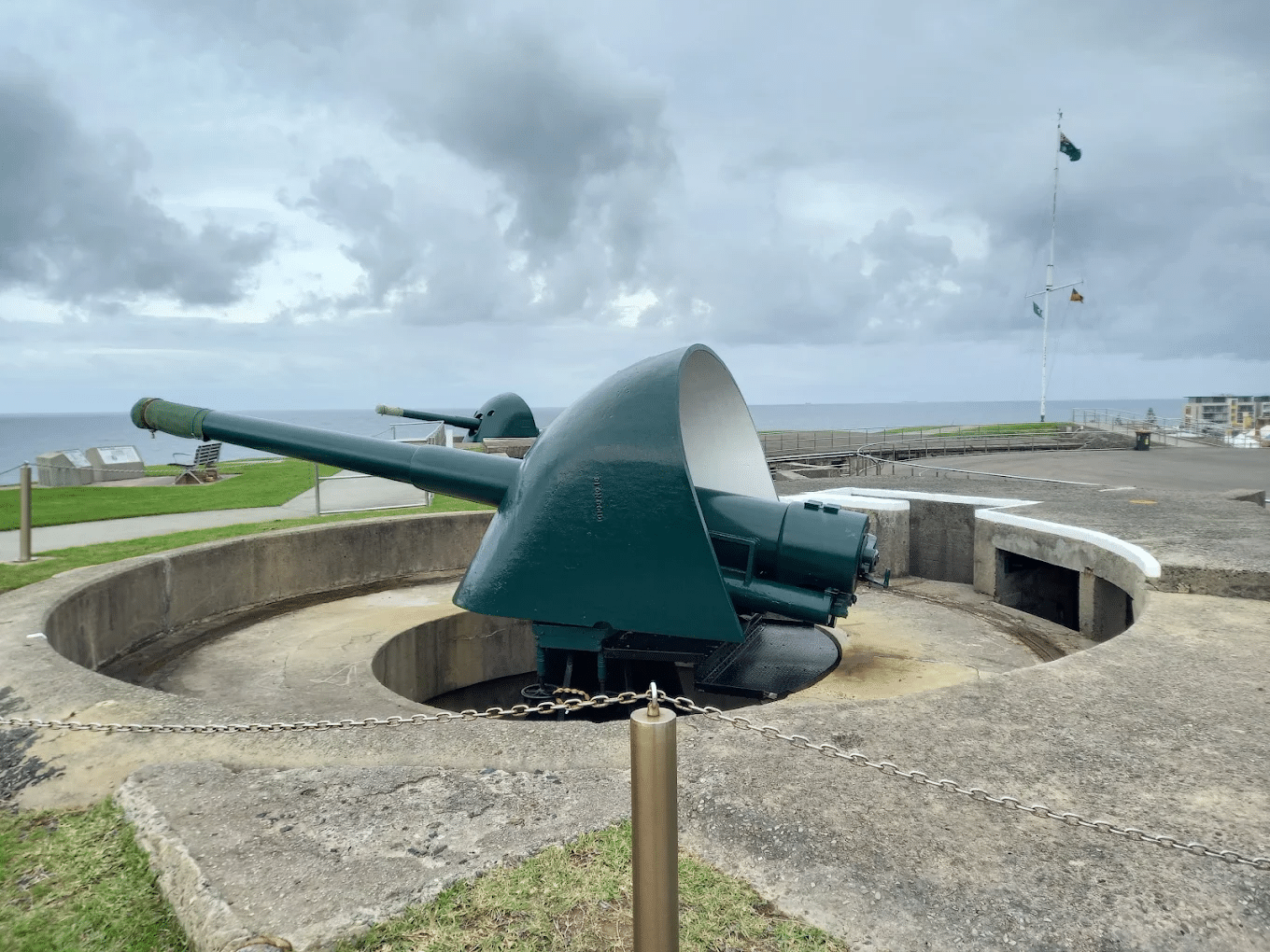 Large green cannon on cement wall at Newcastle