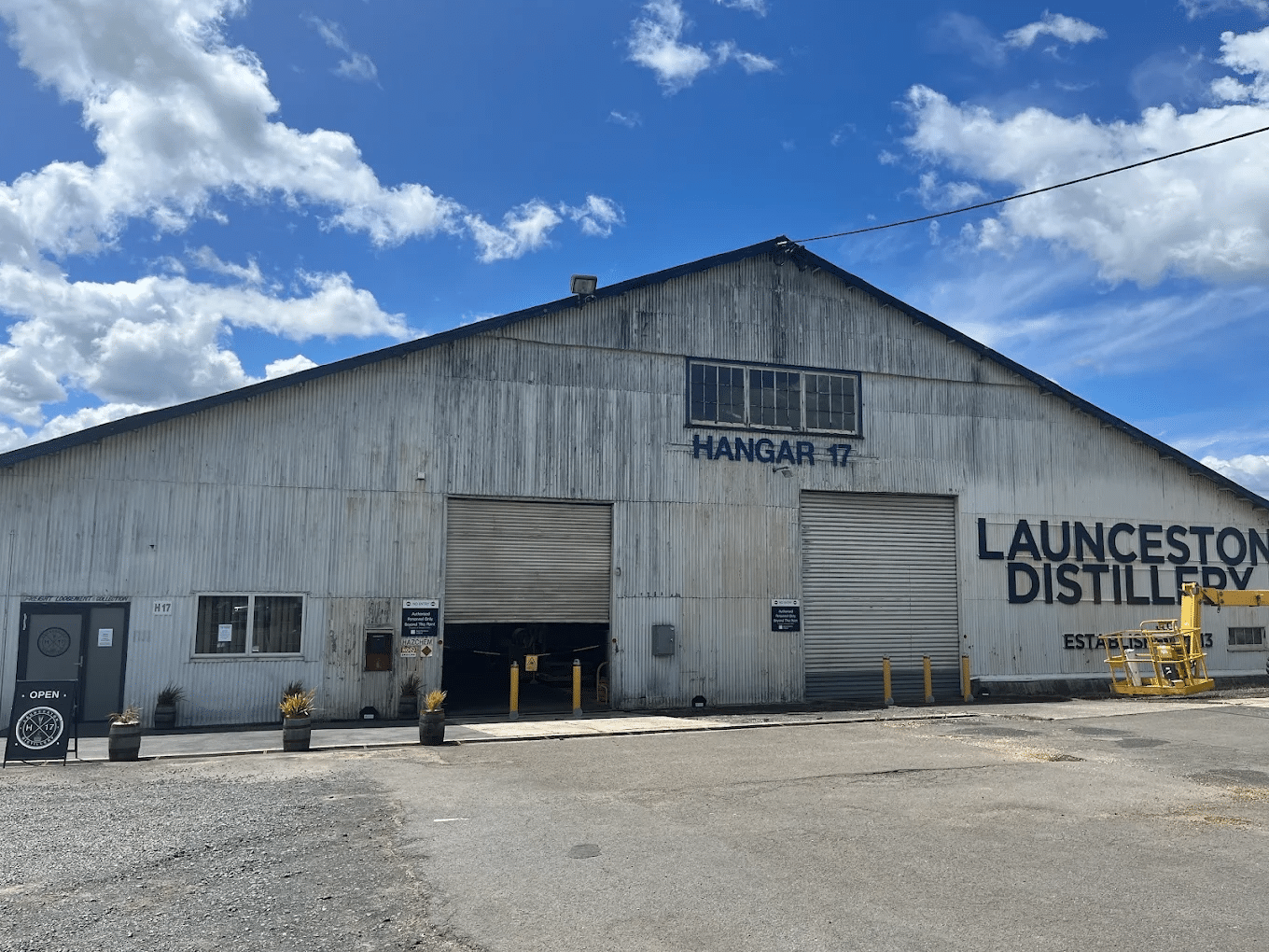 Large industrial building under blue sky in Launceston