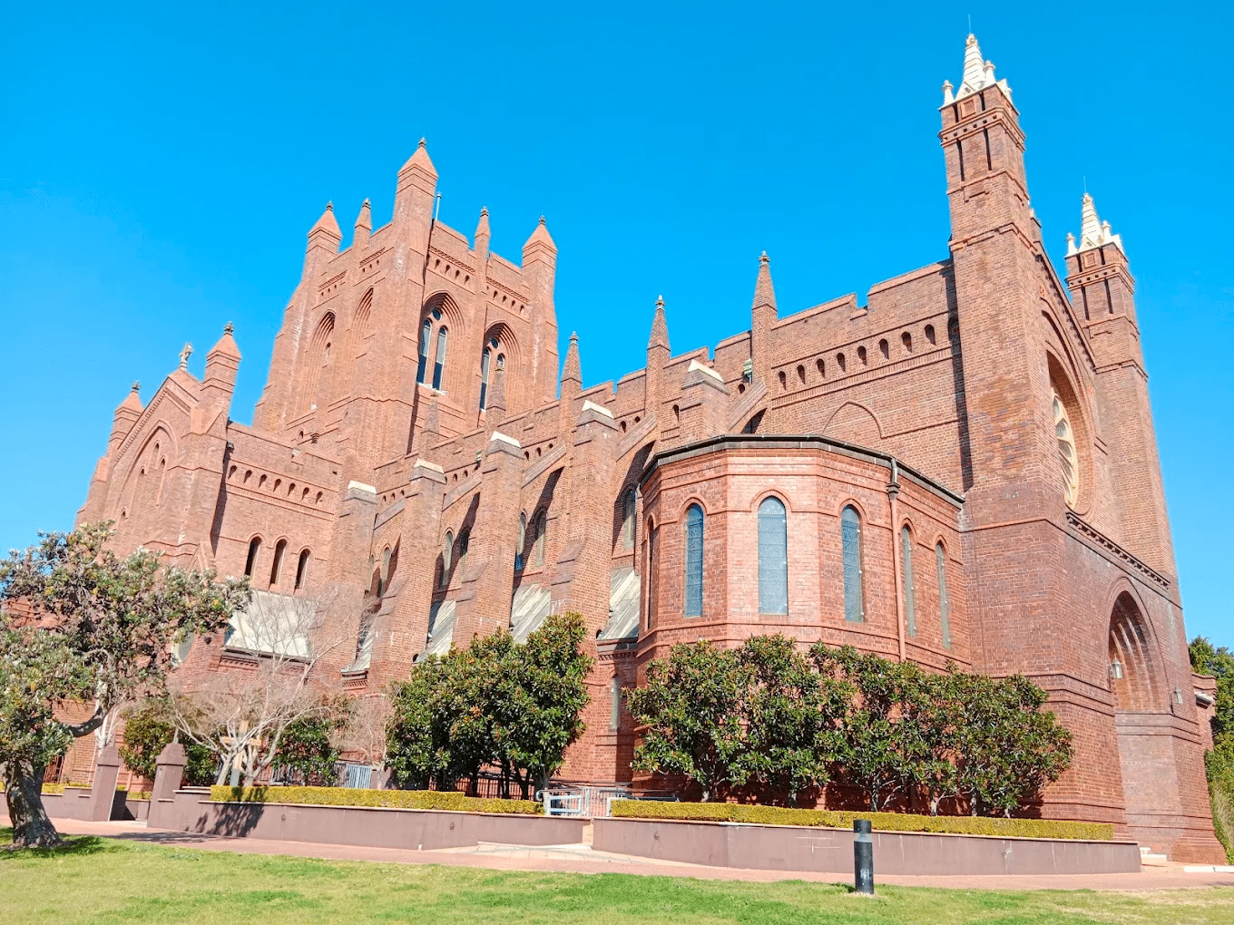 Large red brick building with clock tower in Newcastle