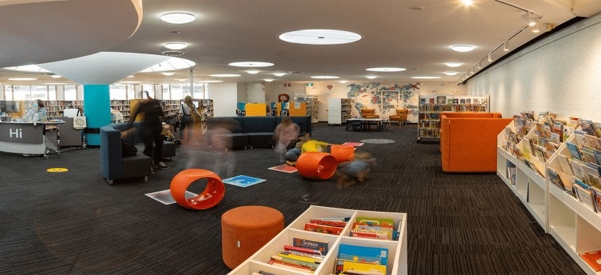 Library with books and children's toys in Manly